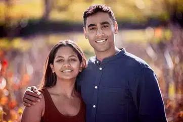 hopeful adoptive couple standing in a field in North Dakota