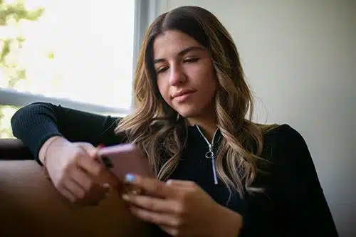 young woman looking at phone